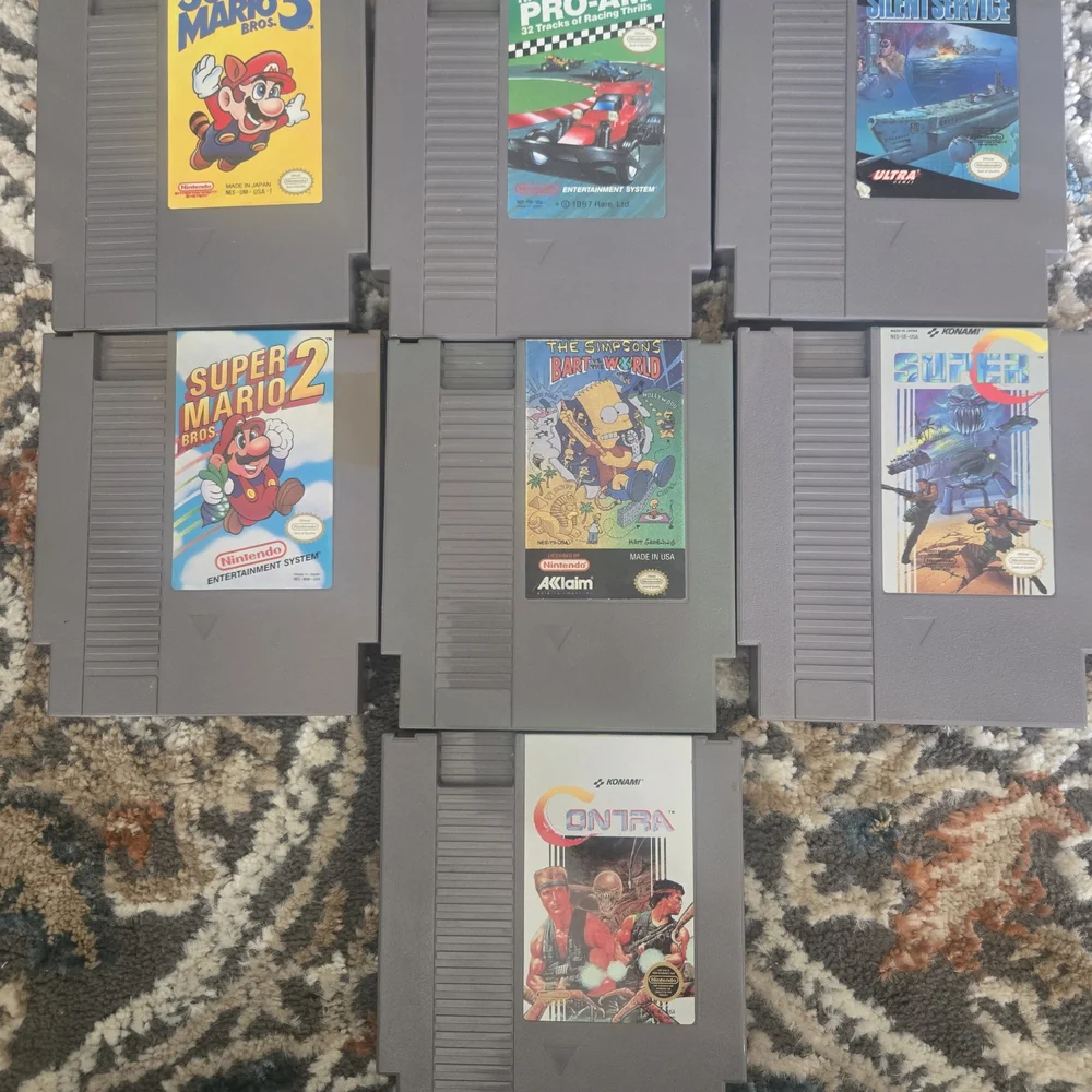 Nintendo Entertainment System with Gray and Black Controllers